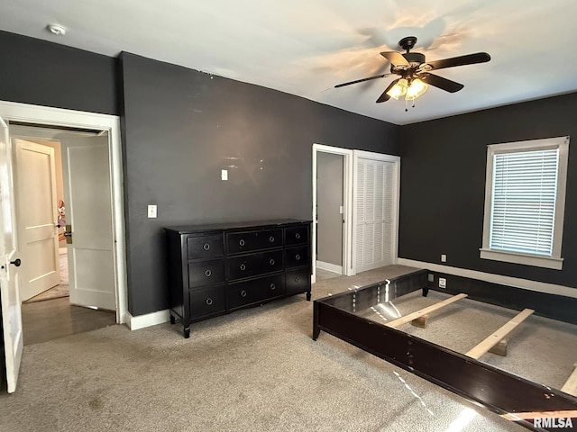 carpeted bedroom featuring ceiling fan and baseboards