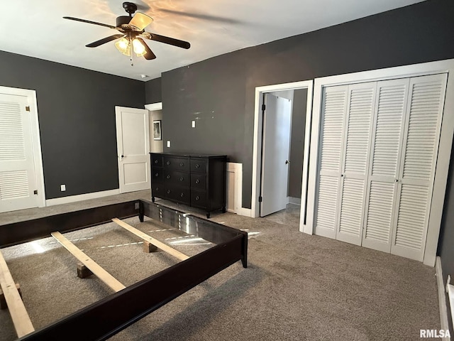 carpeted bedroom featuring a ceiling fan and baseboards