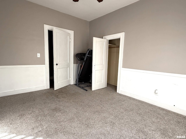 unfurnished bedroom with carpet and ceiling fan