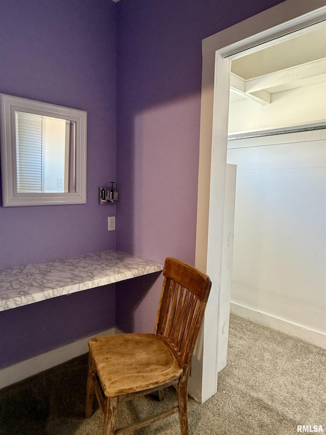 bedroom with carpet and baseboards