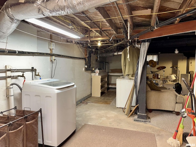 unfinished below grade area with washer / clothes dryer