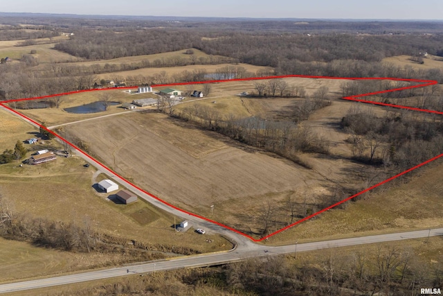 birds eye view of property with a rural view