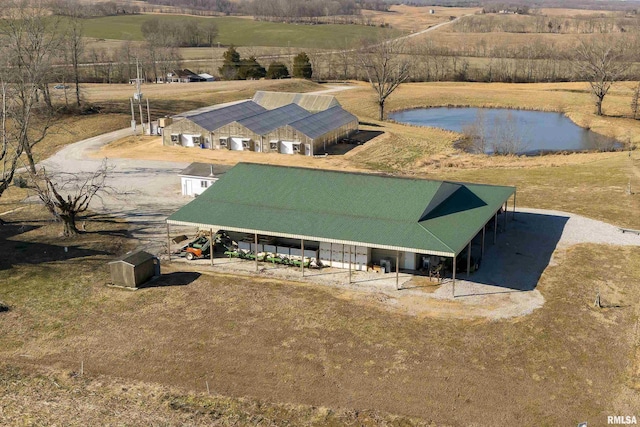 drone / aerial view with a rural view and a water view