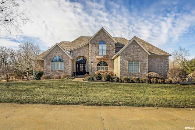 view of front of home featuring a front lawn and french doors