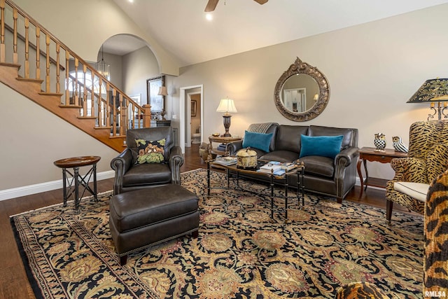 living room with high vaulted ceiling, dark hardwood / wood-style floors, and ceiling fan