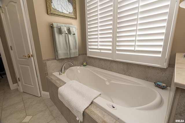 bathroom with a relaxing tiled tub