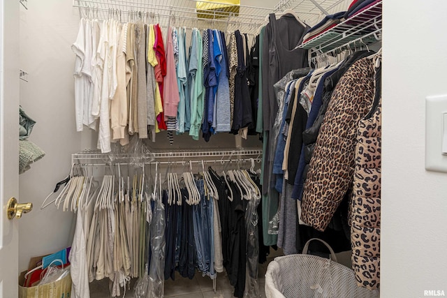 walk in closet featuring tile patterned flooring