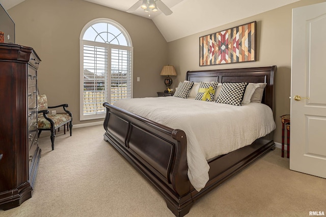 bedroom featuring lofted ceiling, light colored carpet, and ceiling fan