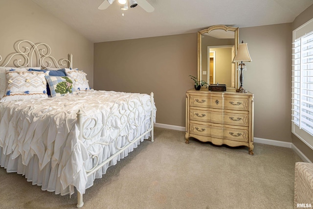 bedroom with light colored carpet and ceiling fan