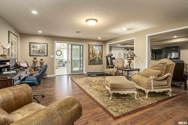 interior space featuring dark hardwood / wood-style floors and a textured ceiling