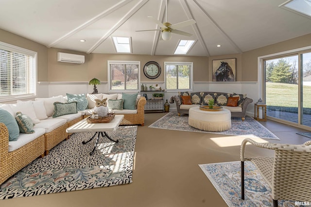 living room featuring ceiling fan, a wall unit AC, and vaulted ceiling with skylight