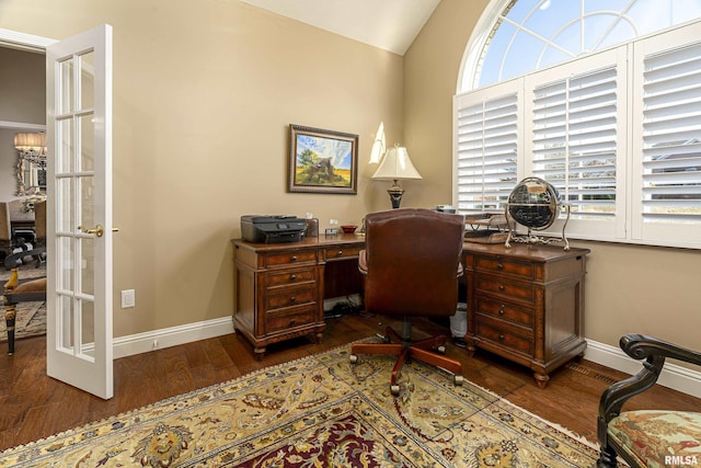 office space featuring lofted ceiling, dark hardwood / wood-style floors, and french doors