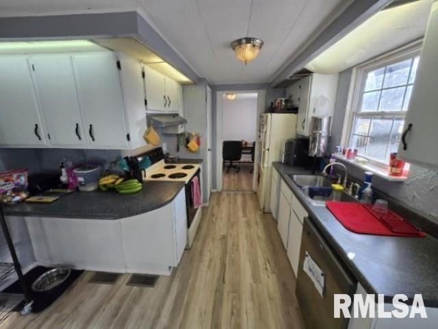 kitchen with white cabinetry, sink, white appliances, and light wood-type flooring