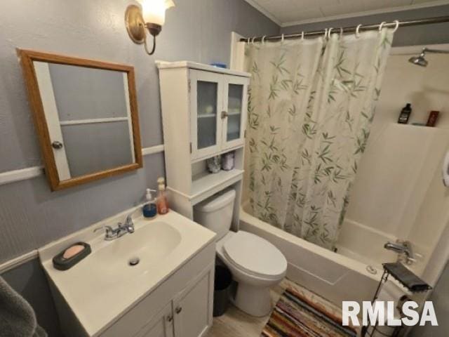 full bathroom featuring vanity, toilet, and shower / bath combo with shower curtain