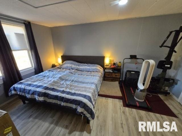 bedroom featuring hardwood / wood-style flooring