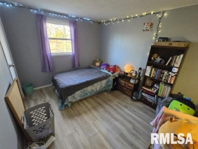 bedroom with light hardwood / wood-style floors