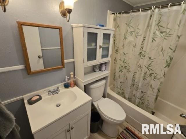 full bathroom featuring vanity, toilet, and shower / tub combo