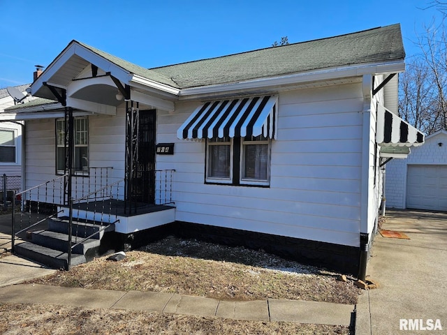 view of front of property with an outbuilding and a garage