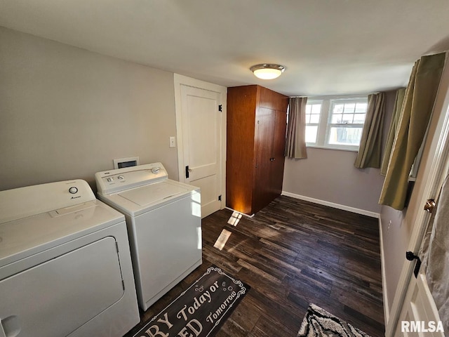 laundry area featuring washing machine and dryer and dark hardwood / wood-style flooring