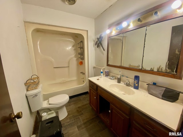 full bathroom featuring vanity, bathtub / shower combination, and toilet