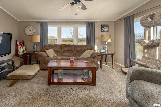 living room featuring crown molding, ceiling fan, carpet flooring, and vaulted ceiling