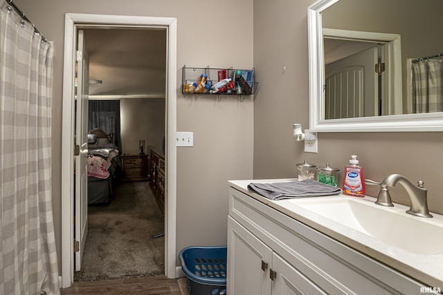 bathroom with hardwood / wood-style flooring and vanity