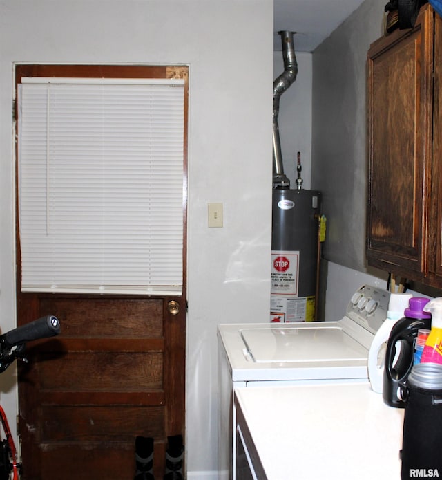 laundry area featuring cabinets, separate washer and dryer, and gas water heater