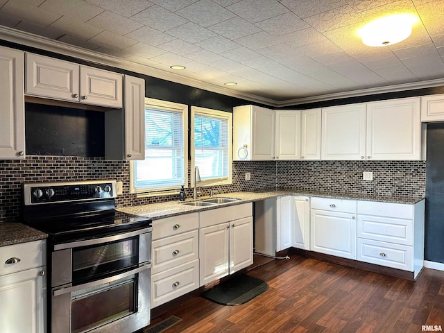 kitchen with white cabinetry, appliances with stainless steel finishes, a sink, and ornamental molding