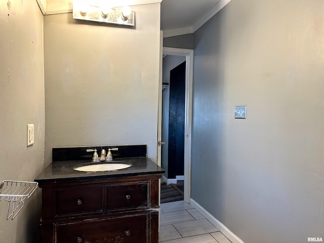 bathroom with baseboards and vanity