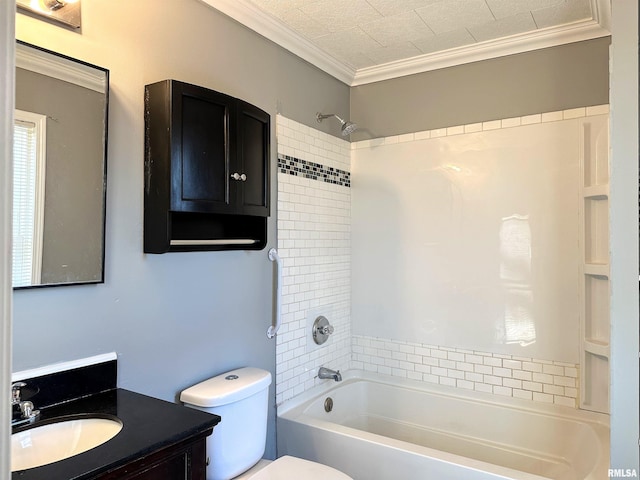 bathroom with washtub / shower combination, toilet, vanity, and crown molding