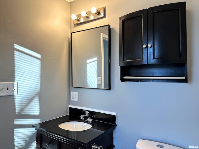 half bath with toilet and vanity