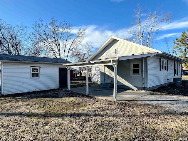 view of home's exterior featuring a carport