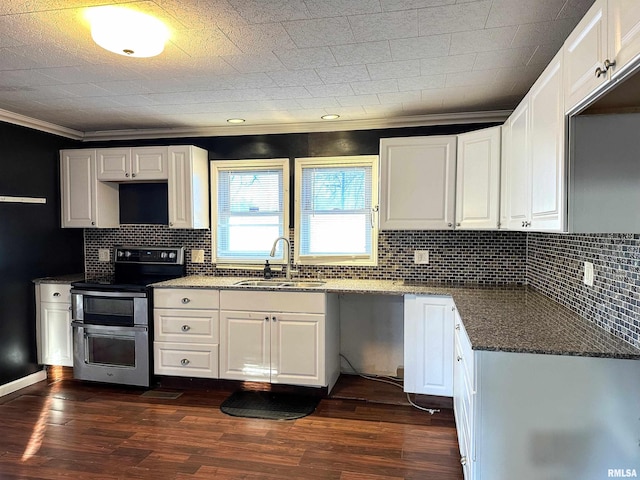 kitchen featuring double oven range, white cabinetry, dark wood-type flooring, and a sink