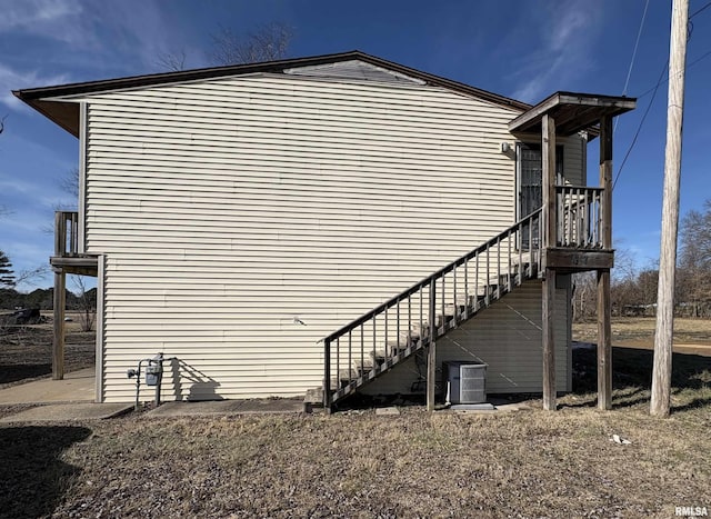 view of side of home featuring central AC unit