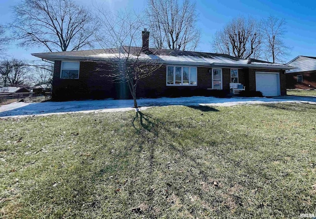 single story home featuring a garage and a front lawn