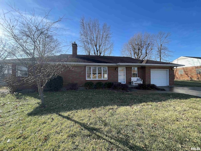 ranch-style house featuring a garage and a front lawn