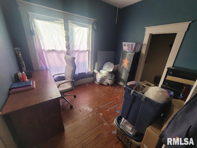 office with dark hardwood / wood-style flooring and a wealth of natural light