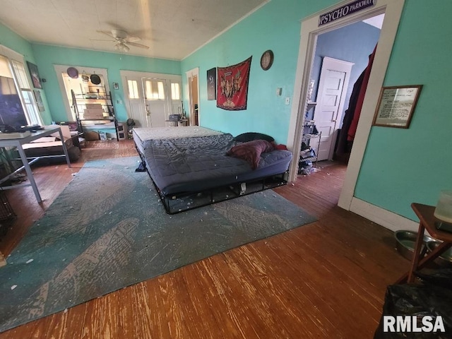 bedroom featuring ceiling fan and dark hardwood / wood-style flooring