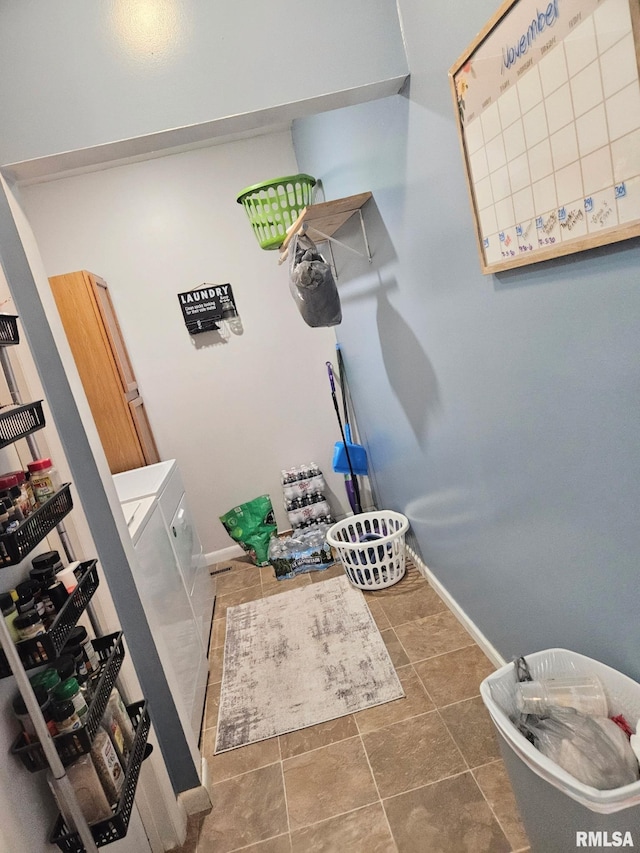 bathroom with washing machine and clothes dryer