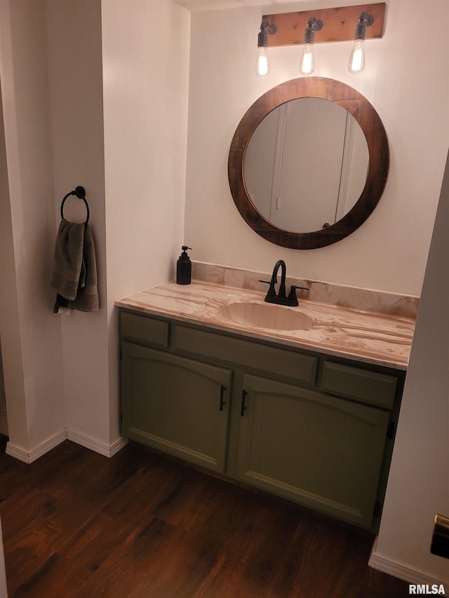 bathroom with hardwood / wood-style flooring and vanity