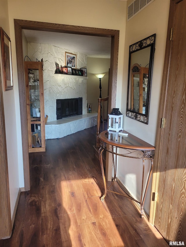 hallway with hardwood / wood-style floors