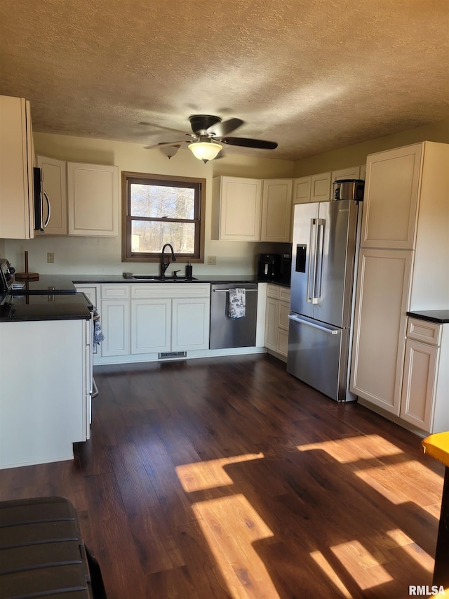 kitchen with stainless steel appliances and white cabinets