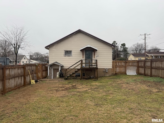 back of property featuring a yard