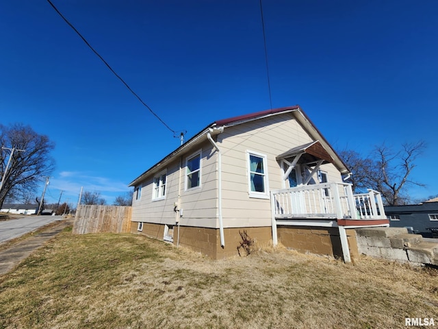 view of property exterior featuring a lawn