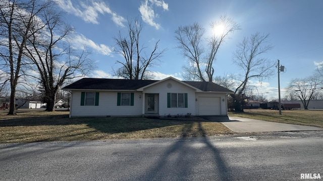 ranch-style house with a garage and a front yard