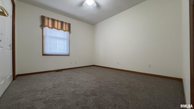 unfurnished room featuring ceiling fan, lofted ceiling, and carpet flooring