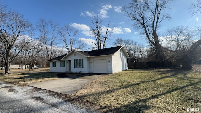 view of front of property with a garage and a front yard