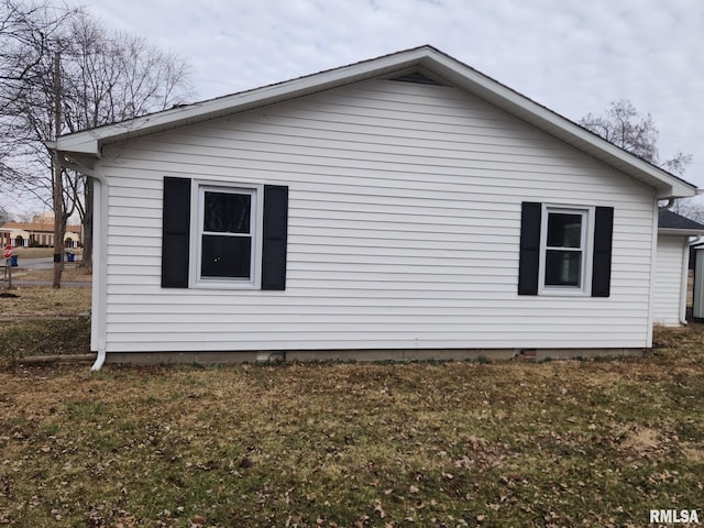 view of home's exterior featuring a yard