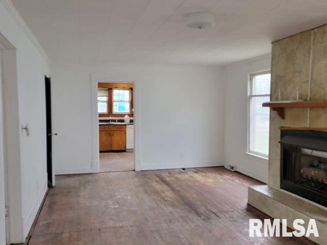 unfurnished living room with light hardwood / wood-style floors