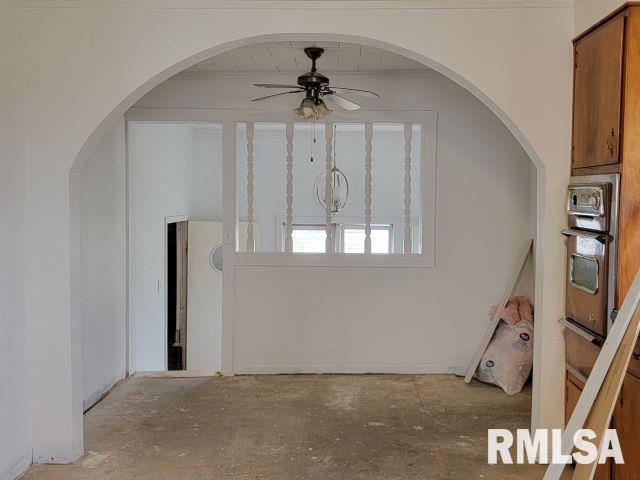 interior space featuring ceiling fan